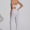 Coralena Jumpsuit mit Verzierungen und Cut-outs in Weiß Coralena Jumpsuit mit Verzierungen und Cut-outs in Weiß