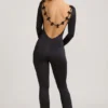 Eulalie Jumpsuit aus geschmeidigem Jersey mit Schleifendetail in Schwarz Eulalie Jumpsuit aus geschmeidigem Jersey mit Schleifendetail in Schwarz
