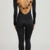 Eulalie Jumpsuit aus geschmeidigem Jersey mit Schleifendetail in Schwarz Eulalie Jumpsuit aus geschmeidigem Jersey mit Schleifendetail in Schwarz