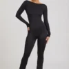 Eulalie Jumpsuit aus geschmeidigem Jersey mit Schleifendetail in Schwarz Eulalie Jumpsuit aus geschmeidigem Jersey mit Schleifendetail in Schwarz