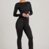 Eulalie Jumpsuit aus geschmeidigem Jersey mit Schleifendetail in Schwarz Eulalie Jumpsuit aus geschmeidigem Jersey mit Schleifendetail in Schwarz