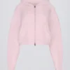Kurzer Hoodie aus weichem Strick mit Reißverschluss in zartem Rosa Kurzer Hoodie aus weichem Strick mit Reißverschluss in zartem Rosa