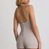 Lalita Playsuit mit Knopfleiste und Neckholder in Ecru Lalita Playsuit mit Knopfleiste und Neckholder in Ecru