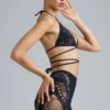 Liberty Bikini-Oberteil mit verzierten Kreuzbändern in Schwarz Liberty Bikini-Oberteil mit verzierten Kreuzbändern in Schwarz