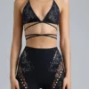 Liberty Bikini-Oberteil mit verzierten Kreuzbändern in Schwarz Liberty Bikini-Oberteil mit verzierten Kreuzbändern in Schwarz