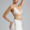 Liberty Bikini-Oberteil mit verzierten Kreuzträgern in Elfenbein Liberty Bikini-Oberteil mit verzierten Kreuzträgern in Elfenbein