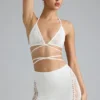 Liberty Bikini-Oberteil mit verzierten Kreuzträgern in Elfenbein Liberty Bikini-Oberteil mit verzierten Kreuzträgern in Elfenbein