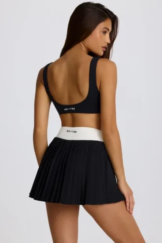 Soft Active Crossover-Minirock mit Falten in Schwarz Soft Active Crossover-Minirock mit Falten in Schwarz