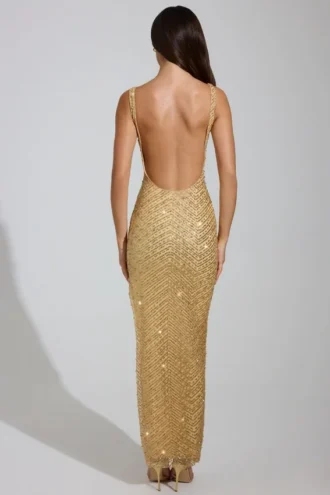 Yarina Maxikleid mit verziertem Rundhalsausschnitt und Schlitz am Oberschenkel in Gold Yarina Maxikleid mit verziertem Rundhalsausschnitt und Schlitz am Oberschenkel in Gold